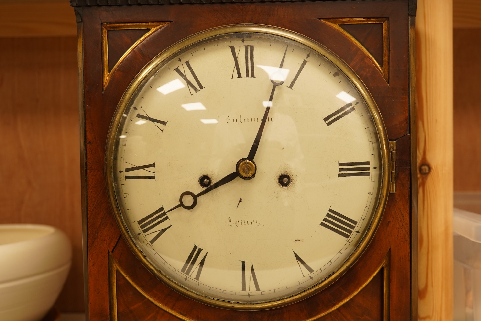 An early 19th century rosewood and brass bracket clock, striking on a bell, with pendulum and key, 47cm high
